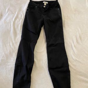 H&M black denim skinny jeans super stretchy. Size 2 mid rise